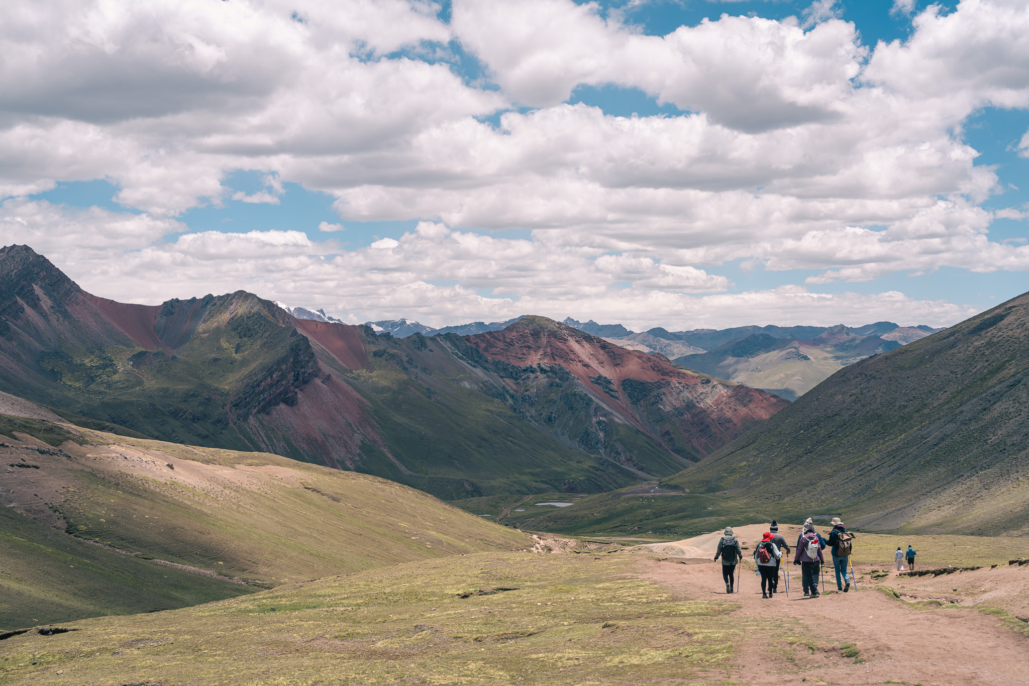 Hikers crossing high mountain landscape