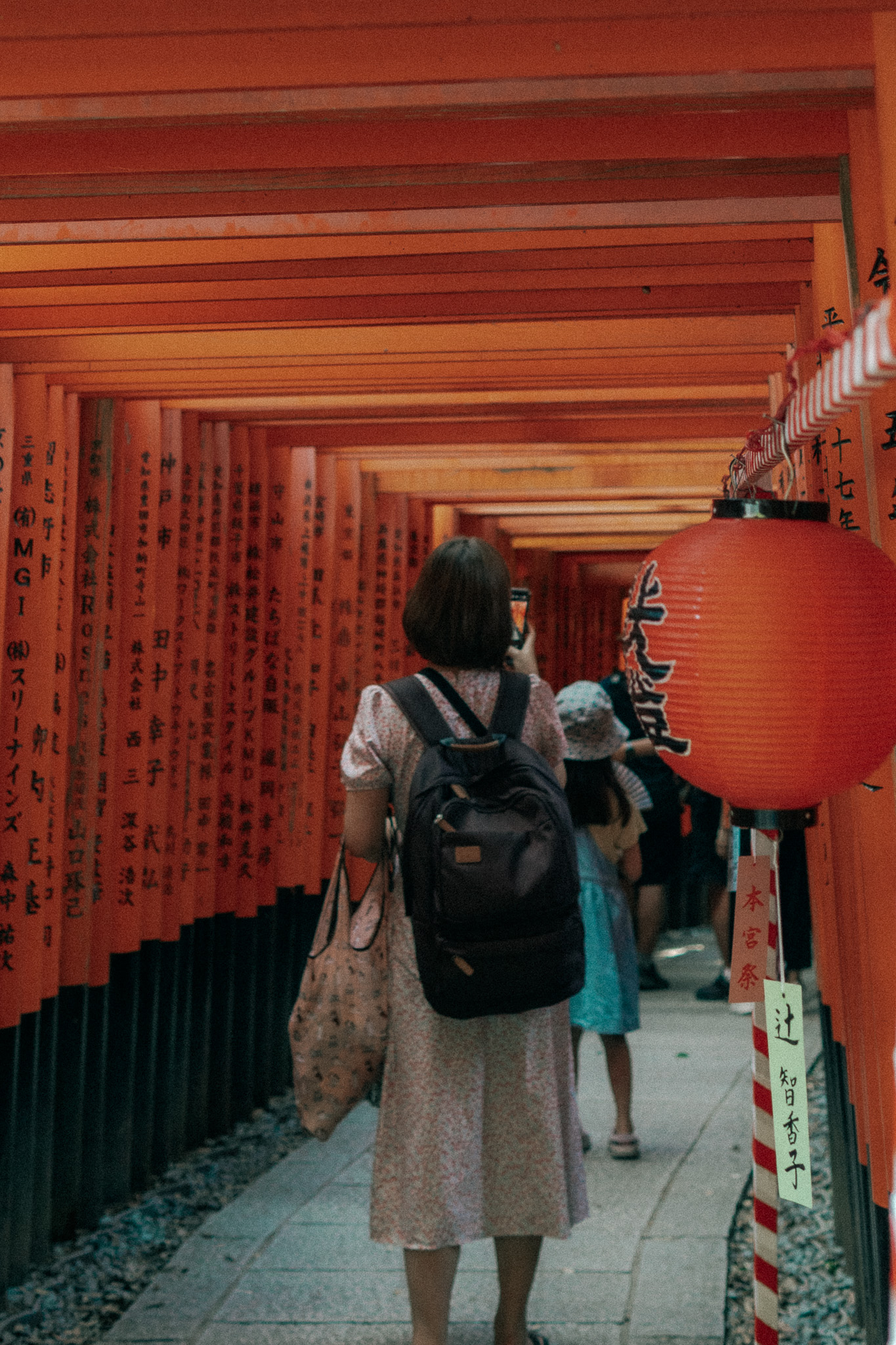Person walking through red corridor